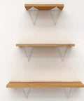Dope Heavy Duty Triangle Shelf Brackets, Badass Wall Mount Floating Support, Industrial Corner Hardware For Bookshelves And Home Decor, 2 Pack Gold White Finish with wooden shelves mounted on a wall.