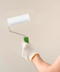 Person holding a small sponge paint roller with slick plastic grip for easy wall touch-ups, part of 10 Piece Small Sponge Paint Rollers With Slick Plastic Grips And Dense Texture Sleeves For No Fuss Wall Painting Easy Rinse Reusable Build Perfect For Quick Home Refresh Jobs.