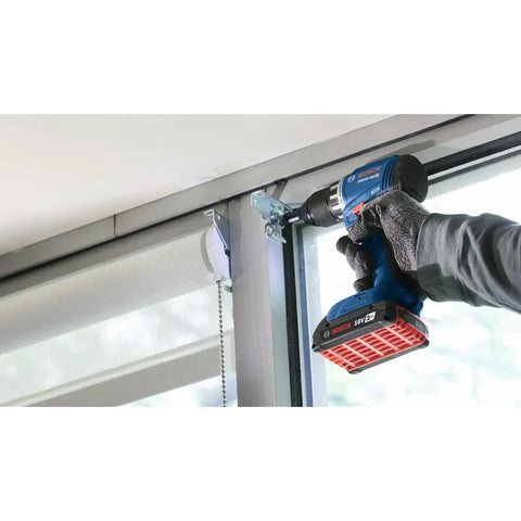 18V Compact Brushless Drill Driver Kit With One Half Inch Chuck And 2 Ah Battery in use on window frame