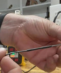 Person using Top Shelf Heavy Duty Adhesive Lined Heat Shrink Tubing Kit, showcasing black heat shrink tubing for wiring.
