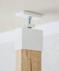 Close-up of Floor To Ceiling 2 X 4 Mounting Brackets For Heavy Duty Vertical Storage and DIY Wall Shelves, showing tension setup.