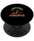Id Rather Be Flying Funny Gyrocopter Gyroplane Autogyro Design PopSockets Grip For Gyrocopter Enthusiasts And Rotorcraft Pilots Adhesive Phone Grip PopGrip For Smartphones Durable And Easy To Install showing text and illustration on black background.