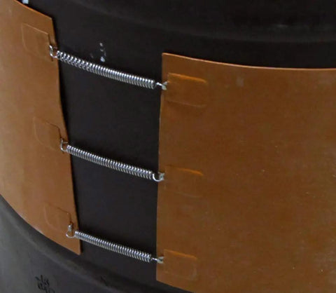 Close-up of large silicone drum heater for 55 gallon drums 1500W at 110 120V with adjustable thermostat, on a metal drum.