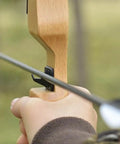Hand using Six Pack Plastic Arrow Rest For Recurve Bow Black Self Adhesive Arrow Rest For Target Practice Hunting And Precision Shooting