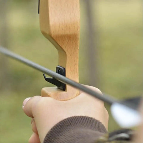 Hand using Six Pack Plastic Arrow Rest For Recurve Bow Black Self Adhesive Arrow Rest For Target Practice Hunting And Precision Shooting