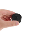 Close-up of a black metal cap from the Set Of 6 Heavy Duty Industrial Shaft Guard Caps, Metal End Protectors For Spindle, Axle And Machine Shafts, Compatible With Grip-O-Matic Pullers, 8056 Machine Models, Prevents Loose Shafts And Misalignment In Precision Equipment.