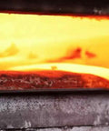 Wolf Sense Scythe Blade 70cm By 50mm Hand Forged In Austria glowing in forge with double peen