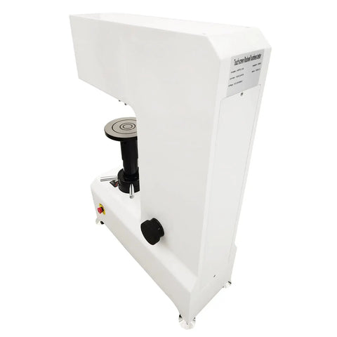 Knockout Precision Digital Rockwell Hardness Tester With Top Shelf Touch Screen LCD And No Sweat High Speed Thermal Printer Ready To Roll For Shop Tests side view showing LCD and testing platform.
