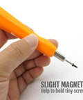 Hand holding Dual End Alloy Steel Torx Screwdriver Bit Kit For Doorbells And Security Video Systems with magnetic tip
