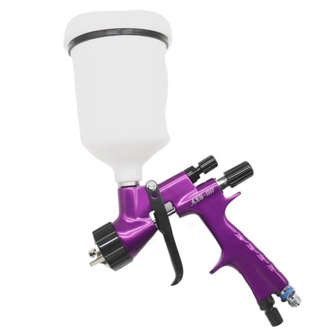 Badass Gold Auto Spray Gun With Heavy Duty 360 Degree Swivel Air Hose Connector And Precision 1.3 Nozzle For Rock Solid High Atomization Car Painting Work, showing purple spray gun with white cup.