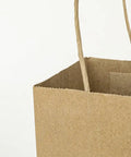 Close-up of open Small Natural Kraft Paper Gift Bags With Handles 5.25x3.25x8.25 Inch Brown Bulk Goody Bags for Party Favors