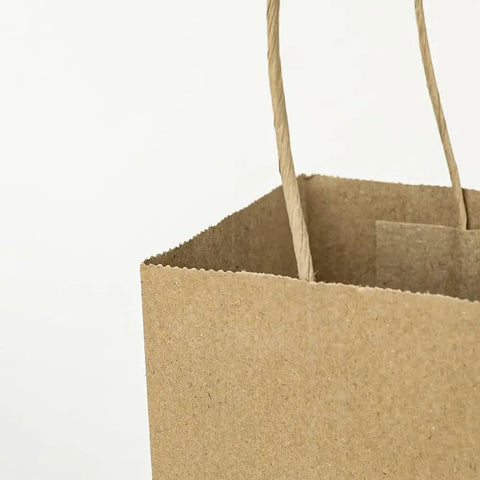 Close-up of open Small Natural Kraft Paper Gift Bags With Handles 5.25x3.25x8.25 Inch Brown Bulk Goody Bags for Party Favors
