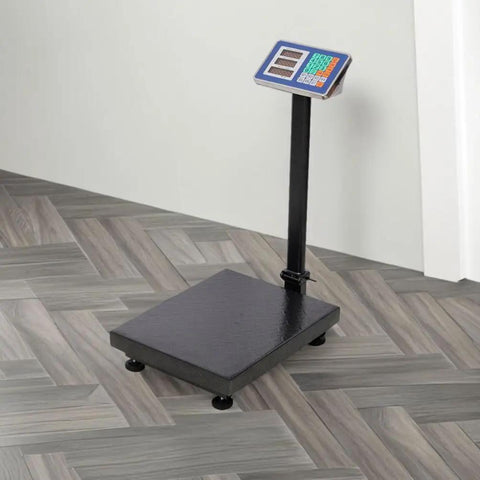 Heavy Duty Shipping Scale With 660 Pound Capacity Foldable Digital Platform absolute breeze for luggage and postal packages on floor.