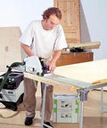 Man using Badass Zero Fuss Plunge Saw With Aluminum Track Guide on a workbench for accurate laminate cuts.