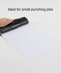 Mini 3 Hole Punch, 6 Sheet Capacity, Portable Desktop Hole Punch For Home Office Or School, being used on blank paper