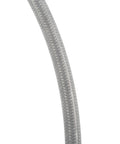 Close-up of braided hydraulic brake hose texture, showcasing durable silver braid for brake fluid transfer, high pressure and heat resistance.