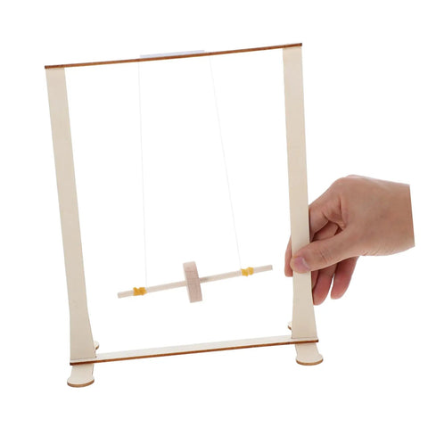 Hand holding Educational Wooden Gravity Experiment Kit For Kids And Students, Interactive Maxwell Wheel Science Toy.
