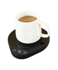Keep Your Daily Drip Stayin Toasty With This Electric Coffee Mug Warmer Featuring Three Custom Temperature Levels Four Hour Auto Shut Off And Compact Desk Base For Zero Cold Sip Regrets, white mug on a black warmer with LCD display.