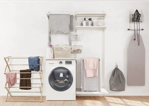 Badass Professional Grade Solid Maple Clothes Drying Rack Heavy Duty Collapsible Air Dryer No Hassle Wooden Rack in laundry room.