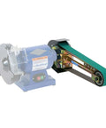 Hella Compatible 2X48 Belt Grinder Attachment Converts Standard Bench Grinder Into Rock Solid Vertical Or Horizontal Grinding Rig Featuring No Sweat Quick Change Tension System mounted on a blue grinder with green belt.