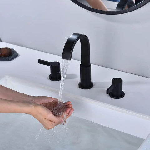Person washing hands under Matte Black 3 Hole 8 Inch Widespread Bathroom Faucet With Brass Lavatory Vanity Sink, Overflow Pop Up Drain, cUPC Waterlines, 360 Degree Swivel Spout, Built To Last Solid Brass With No Drip Ceramic Cartridge