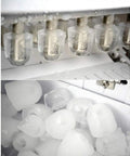 Compact Countertop Ice Maker Whips Up Quick Chill Cubes In Minutes Flat, showcasing clear ice cubes freezing in a metal tray.
