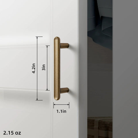 Six Pack 3-Inch Classic Curvature Cabinet Handles In Antique Brass, Vintage-Style Zinc Alloy Hardware installed on white cabinet
