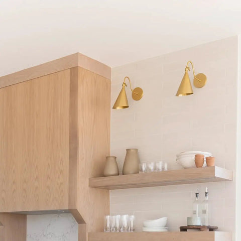 Lupe Wall Sconce Brass With Perforated Shade And Bowtie Swivel Dope Industrial Chic in kitchen setting