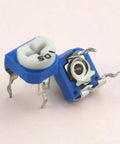 Close-up of 6mm trimmer potentiometers from the 100 Piece 6mm Trimmer Potentiometer Assortment Kit With 500 Ohm To 1 Megaohm Range Top Adjustment 3 Terminal Variable Resistors Carbon Film Metal Body Great For PCB Projects And Prototyping.