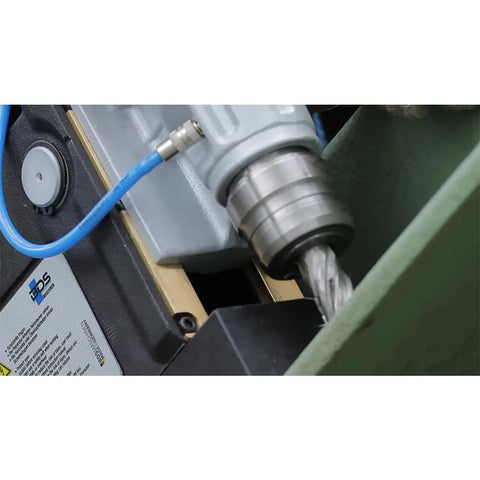 Close-up of Super Lightweight Portable Magnetic Drill Press By CS Unitec MAB 100 K showing quick change Weldon chuck in action.