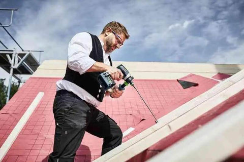 Person using Badass Cordless Drill Driver Featuring Ec Tec Brushless Motor High Torque Heavy Duty Power Tool on a sloped surface.