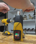 Person using a heat gun for Top Shelf Heavy Duty Adhesive Lined Heat Shrink Tubing Kit with wiring prep.