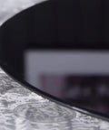 Close-up of Black Rotating Glass Serving Tray For Kitchen Round Lazy Susan Turntable Tabletop Plate Heavy Duty With Stable Base
