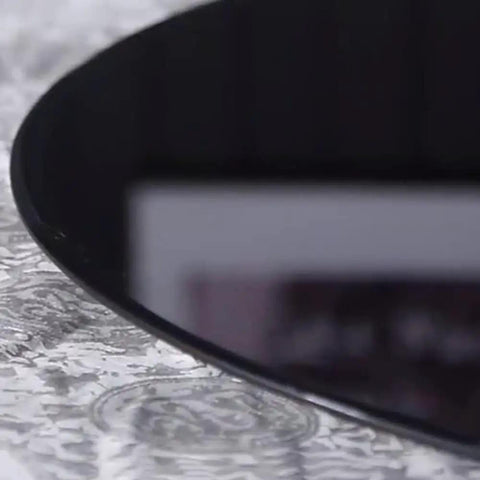 Close-up of Black Rotating Glass Serving Tray For Kitchen Round Lazy Susan Turntable Tabletop Plate Heavy Duty With Stable Base