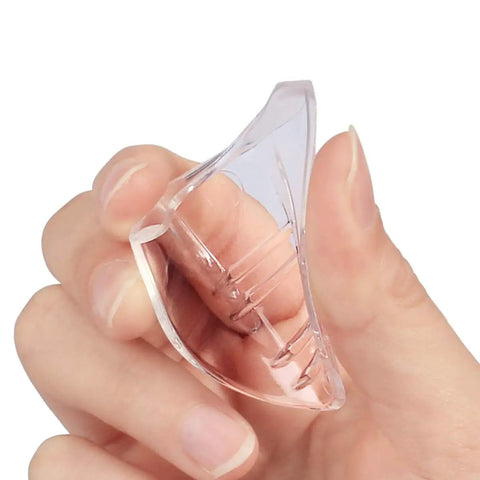 Close-up of a hand holding a clear TPU side shield from the 10 Pack Slip On Eye Glasses Side Shields For Safety Glasses, Flexible TPU Protective Shields.