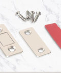 4 Pack Cabinet Magnetic Door Catch Set With Stainless Steel Shell, screws, and adhesive on a marble surface