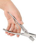 Hand holding stainless steel pig ear tag pliers for farm animals identification tool V shape lightweight and durable