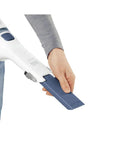 Hand using Cordless Lithium Hand Vacuum Dustbuster for Quick Cleanups Across Cars, Furniture, and Carpets, Ink Blue nozzle attachment.