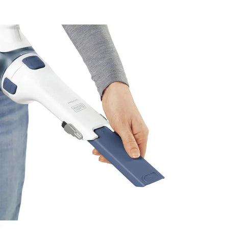 Hand using Cordless Lithium Hand Vacuum Dustbuster for Quick Cleanups Across Cars, Furniture, and Carpets, Ink Blue nozzle attachment.