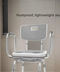 360 Degree Swivel Shower Chair With Back Support, adjustable height, in aluminum; cushy arm rests visible in a shower setting