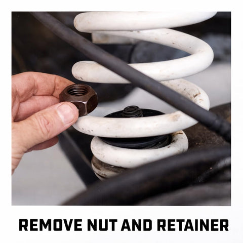 Removing nut with Coil Spring Compressor Tool Kit For Struts And Coil Springs DIY Friendly Safe Heavy Duty Chrome Vanadium Steel.