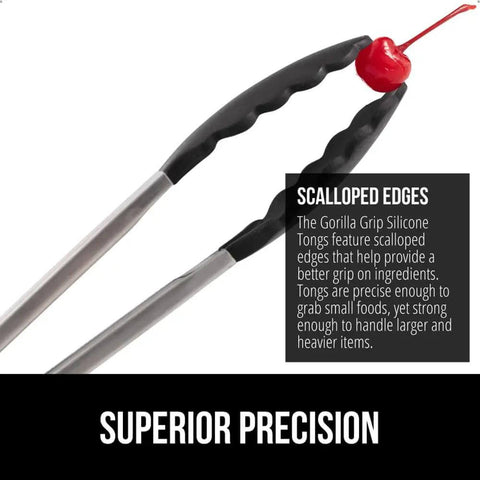 Heavy Duty Stainless Steel Kitchen Tongs Set Of 2 With Heat Resistant Silicone Tips holding a cherry, showcasing scalloped edges.