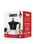 Heavy Duty Moka Induction Coffee Maker With Rock Solid Stainless Steel Boiler And Premium Aluminum Lid Brews Smooth Two Cup Espresso That Nails Your Morning Kickstart In Deep Black displayed in packaging.