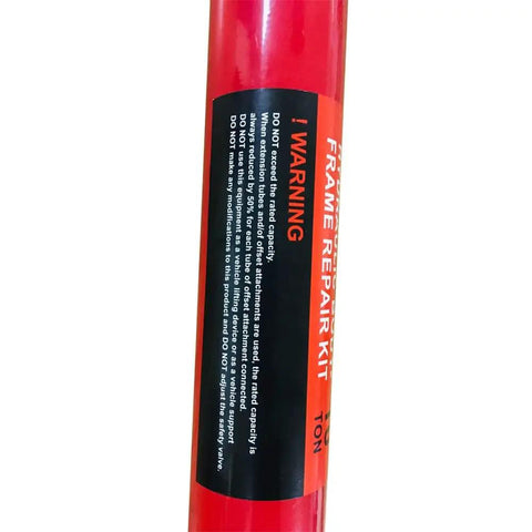 Red 10 Ton Hydraulic Hand Pump Ram for Heavy Duty Lifting and Auto Repair Tool; warning label visible.
