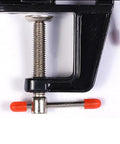 Close-up of a Compact Mini Vise Clamp With A Rock Solid Hold for woodworking tasks, featuring a black finish and durable screw.