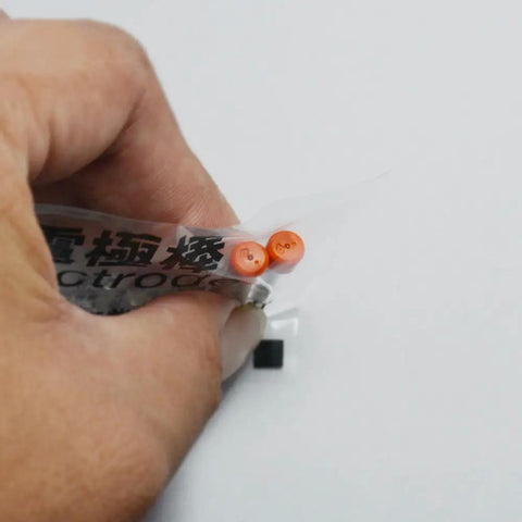 Hand holding Fiber Optic Fusion Splicer Electrodes Kit For T39 T81C T71C T71M T600C Q101 ER10 Z1C Type 81C Replacement Electrodes