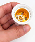 Hand holding a 4 Pack E26 E27 Lamp Socket Adapter Converts Outlet To Dual E26 Light Sockets For Lamps And Fixtures, view of socket interior