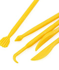 Close-up of yellow tools from 14 Piece Clay Carving Set For Pottery And Sculpting DIY Plastic Polymer Modeling Tools Kit With Comfortable Grips