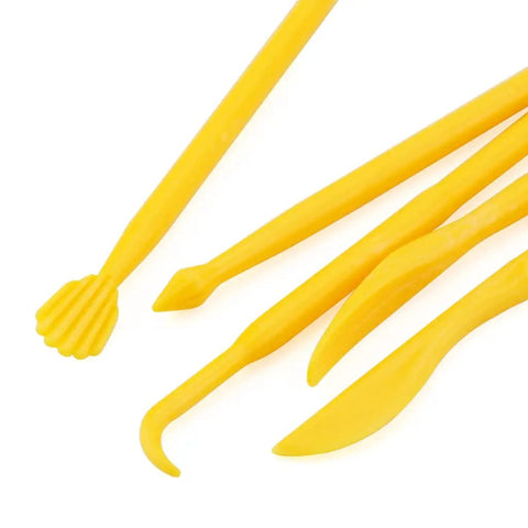 Close-up of yellow tools from 14 Piece Clay Carving Set For Pottery And Sculpting DIY Plastic Polymer Modeling Tools Kit With Comfortable Grips