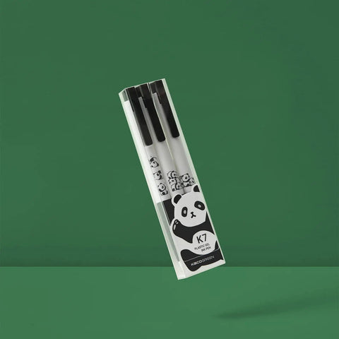 Three Panda Pattern Gel Ink Pens Set With All Black Ink 0.5mm Fine Point Comfortable Soft Grip ABS Pens package on green background.